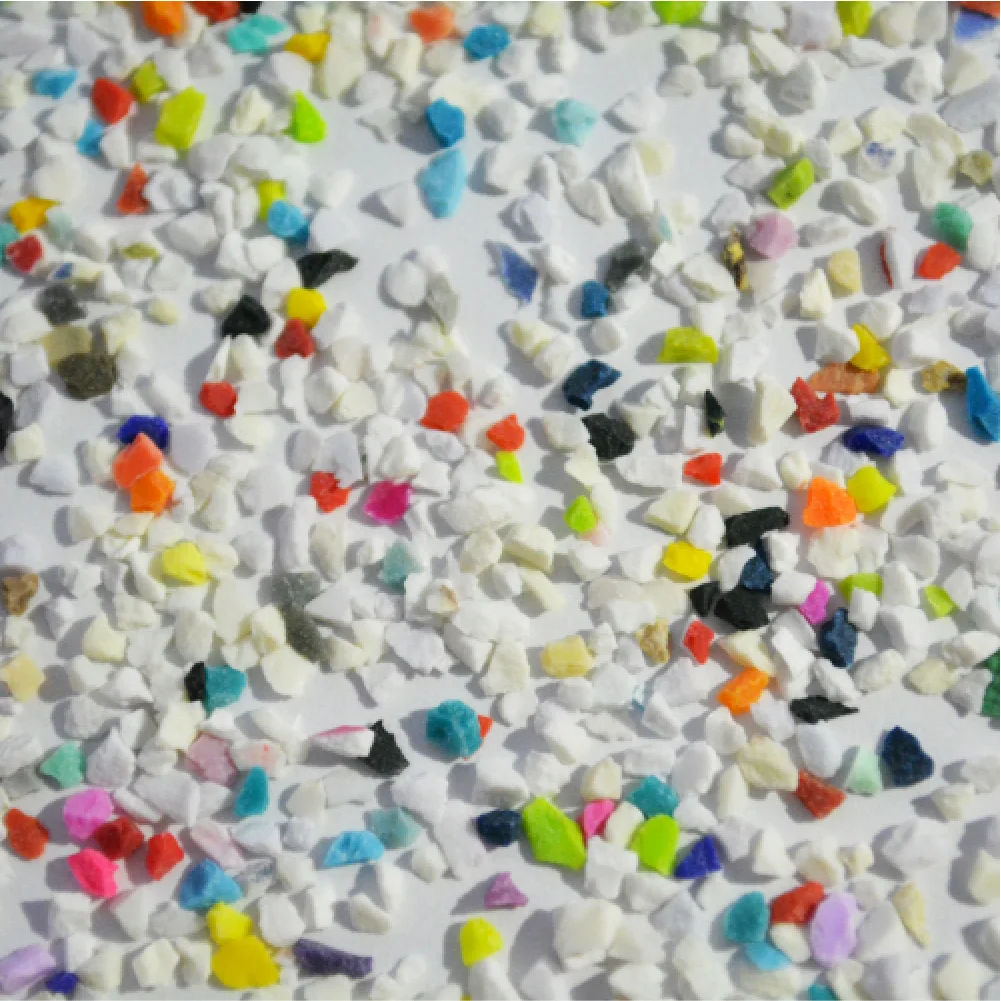 Close view of mixed-colour melamine plastic blasting media