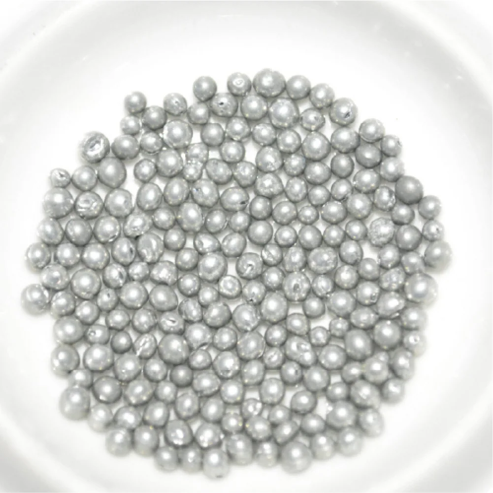 Close view of round metallic steel shot blasting media