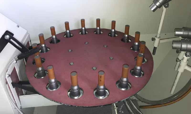 Indexing turntable within an industrial sandblasting machine